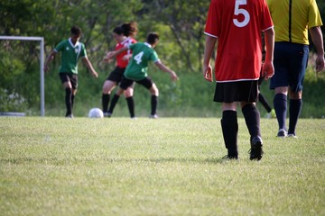 Obraz premium Teens are playing soccer