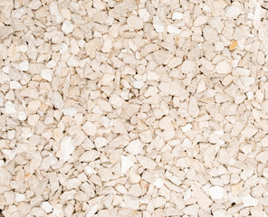 Vue gros plan d'une texture de pierre, gravier et sable blanc