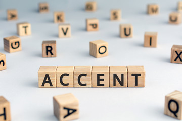 accent - word from wooden blocks with letters, the way to  pronounce words accent concept, random...