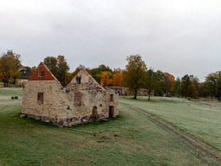 Fototapeta na wymiar old stone building with round arched windows, autumn