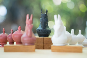 Red and white Knight Thai chess selective focus of black Knight Thai chess