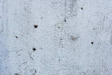 Texture of a concrete wall with cracks and scratches which can be used as a background