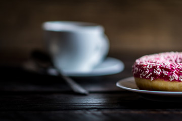Pink donut with white sprinkle