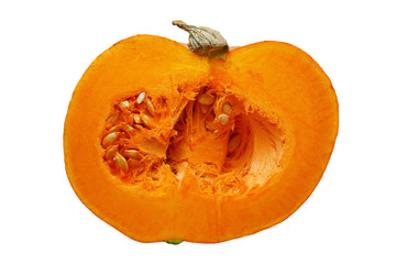 Cross section of a big ripe orange pumpkin isolated on white background. Cut the pumpkin with a knife in half. Pumpkin guts. Unprecedented harvest of pumpkins. Close-up.