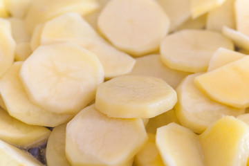 Potatoes fried in a pan on vegetable oil. Potato close-up, cooking.