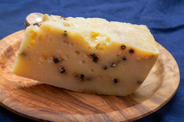 Italian aged pecorino cheese with black peppers made in region Nebrodi, Sicily, Italy