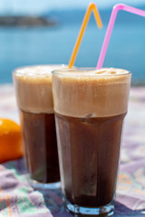 Traditional greek cold coffee Frappe made from water, instant coffee and ice cubes