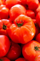Red ripe tomatoes on farmets market close up