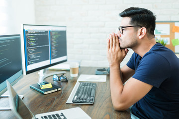 Attractive Latin Computer Science Freelancer Looking At Screens