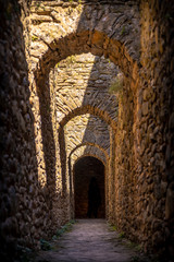 Jaca, Huesca / Spain »; September 29, 2019: Narrow corridors in the citadel of Jaca, vertical photo