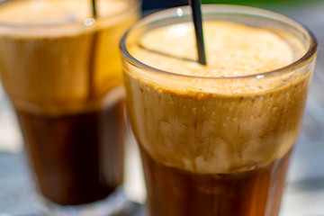 Traditional greek cold coffee Frappe made from water, instant coffee and ice cubes