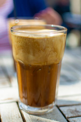 Traditional greek cold coffee Frappe made from water, instant coffee and ice cubes