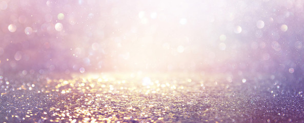 abstract glitter pink, purple and gold lights background. de-focused. banner