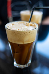 Traditional greek cold coffee Frappe made from water, instant coffee and ice cubes