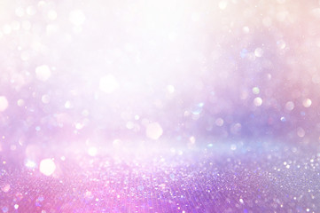 abstract glitter pink, purple and gold lights background. de-focused