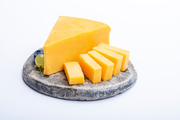 Cheddar cheese collection, piece of yellow Cheddar cheese made from cow milk