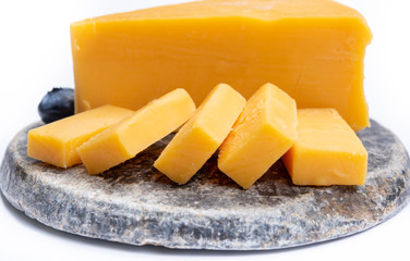Cheddar cheese collection, piece of yellow Cheddar cheese made from cow milk