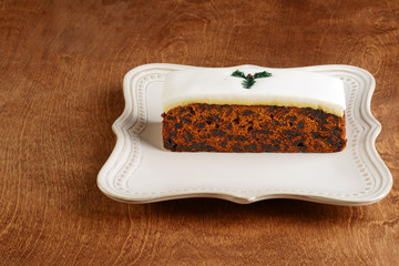 christmas fruitcake with fondant on a platter
