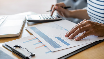 Fototapeta premium Business team brainstorming and discussing with financial data and report graph. Teamwork meeting working concept.