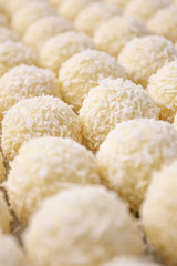 Round sweets with coconut. Raw handmade candy, healthy dessert.