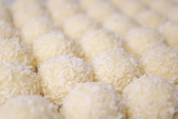 Round sweets with coconut. Raw handmade candy, healthy dessert.