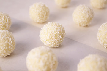Round sweets with coconut. Raw handmade candy, healthy dessert.