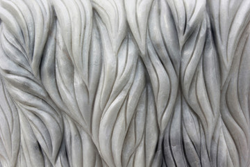 Swaying patterns of marble carving.