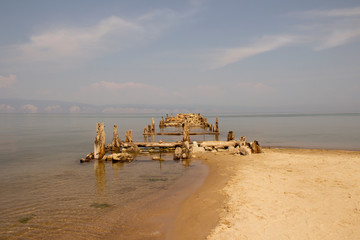Old broken boat pier on the island of Olkhon on Lake Baikal