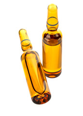 Ampoules. Transparent capsules with liquid on white background. Photo
