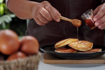 Pancakes served honey on table, healthy breakfast for everyday. Clean food good taste for advertising ideas concept. 