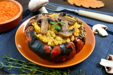 Lentil porridge with mushrooms in a pumpkin pot. Dietary, lean menu. Vegetarian dish.