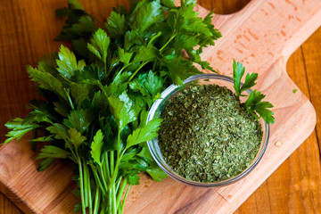 Dried parsley seasoning on wooden table