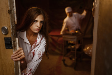 Obraz na płótnie Canvas Patient trying to get away from doctor maniac