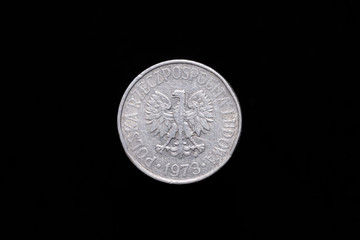 Polish People's Republic, Polska Rzeczpospolita Ludowa old 50 groszy coin from 1973, obverse showing the coat of arms. Isolated on black background