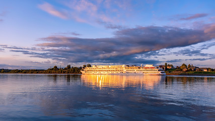 Fototapeta premium Cruise ship on the River at sunset 