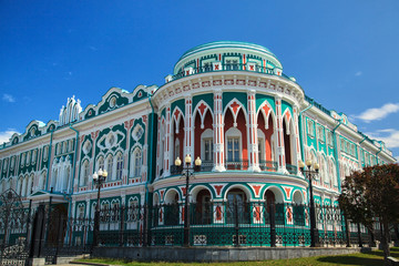 Sevastyanov House in Yekaterinburg, Russia. Its a palace built in the first quarter of XIX century on the banks of the city river Iset. Sunset cloudy sky background