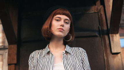 Portrait of fashionable young woman on the porch