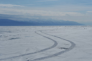 Winter on Lake Baikal. The huge blocks of stone were frozen as a result of the freezing of the washing waves.