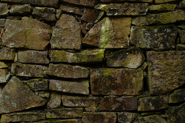 pattern gray color of modern style design decorative uneven cracked real stone wall surface with...