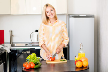 Young woman cooking in the kitchen