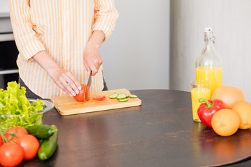 Young woman cooking in the kitchen