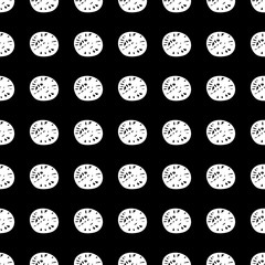 A seamless vector graphic pattern with white textured polka dots on a black background. Surface print design.