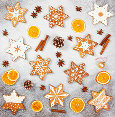 Christmas ginger cookies in the shape snowflakes, dried orange and star anise