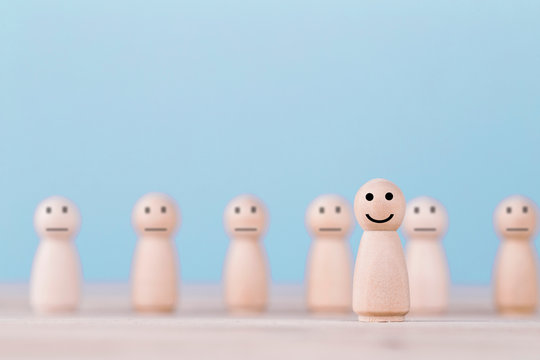 Smile emoticon icons face happy symbol on wooden human , Services and Customer satisfaction survey concept