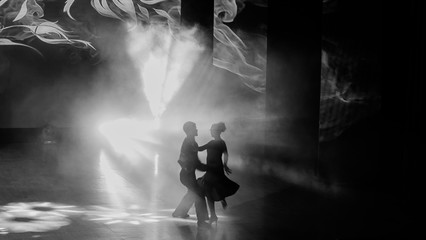 The couple is dancing on the tango scene. Tango Dance Passionate dance of two people.