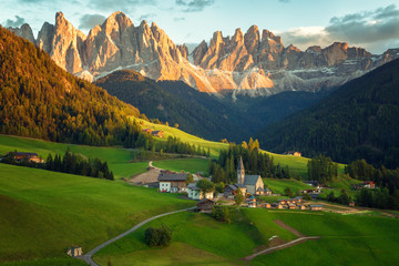 Santa Maddalena village in front of the Geisler or Odle Dolomites Group , Val di Funes, Italy,...