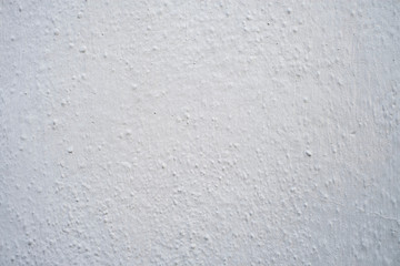 Rough bumpy white or gray stucco or concrete - background or texture