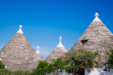Fototapeta na wymiar Traditional Trulli houses, stone roof. Alberobello, Puglia, Italy