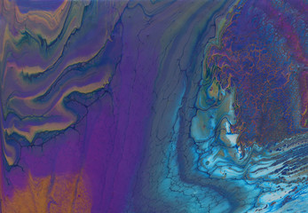 art photography of abstract marbleized effect background. purple, blue and gold creative colors. Beautiful paint.