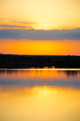 orange sunset on a blue lake